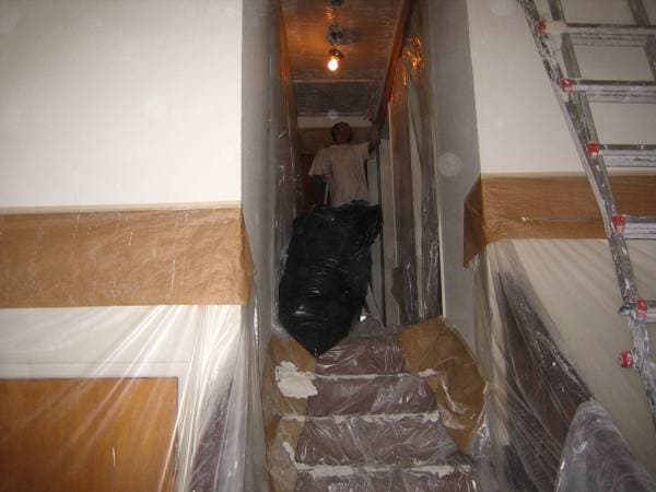 Drywall ceiling repair with seams taped and mudded.