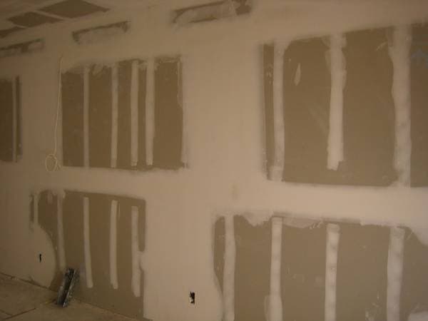 Drywall repair patch blended into existing wall.