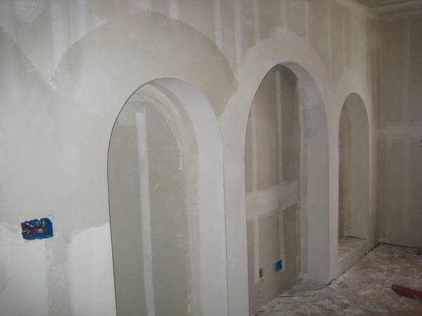 Garage drywall installation with clean cutouts.